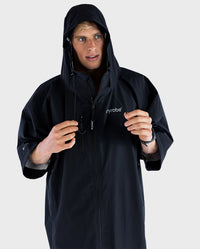 *MALE* wearing dryrobe® Lite with hood up