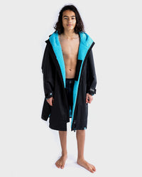 Boy wearing Black Blue dryrobe® Advance Kids Long Sleeve unzipped