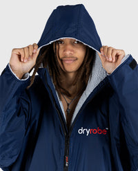 Close up of *MALE* wearing Navy Grey dryrobe® Advance Long Sleeve with the hood up