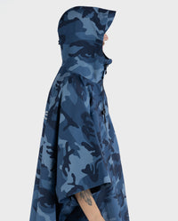 *MALE* stood facing the side wearing  Blue Camo dryrobe® Waterproof Poncho  with hood up 