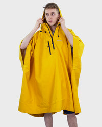 *MALE* wearing  Yellow dryrobe® Waterproof Poncho unzipped with hood up 