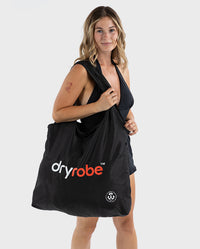 Woman carrying dryrobe® Tote Bag over her shoulder 