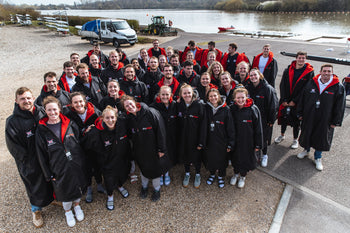 Group shot of the British Rowing team in dryrobes 