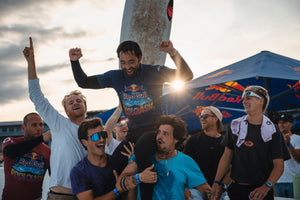 Surfers holding up another surfer in celebration at Red Bull Pool Clash 2025 in Munich, Germany