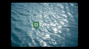 A graphic showing the GreenKayak and dryrobe® logos side-by-side over a background of shimmering, rippling water.