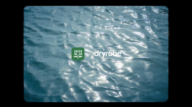 A graphic showing the GreenKayak and dryrobe® logos side-by-side over a background of shimmering, rippling water.