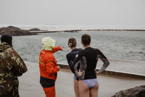 RNLI Lifeguard Richard Heard, Keri-anne Payne, Sophie Hellyer looking at the sea