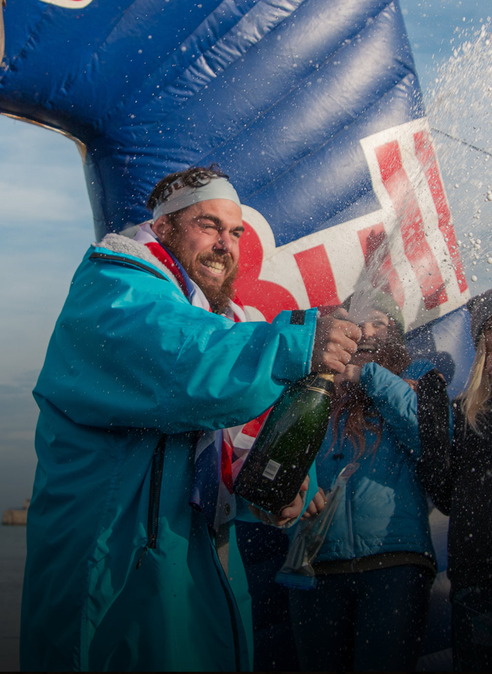 dryrobe® ambassador popping champagne