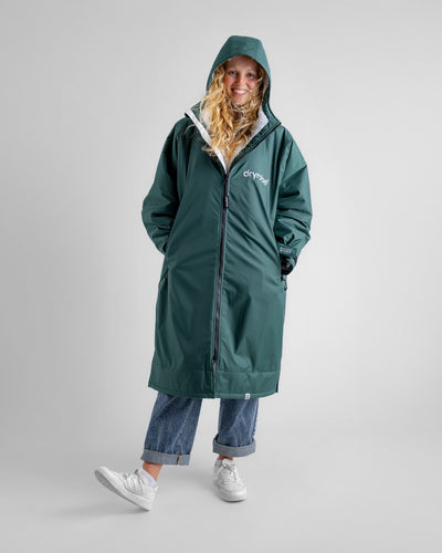 Female in studio wearing AW25 Green Dryrobe® advance long sleeve 
