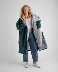 Female in studio wearing AW25 Green Dryrobe® advance long sleeve 