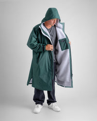 *MALE* in studio wearing AW25 Green Dryrobe® advance long sleeve 