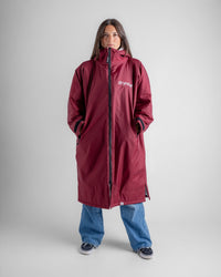 Female in studio wearing AW25 Burgundy Dryrobe® advance long sleeve 
