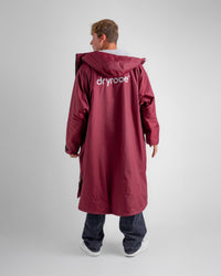 *MALE* in studio wearing AW25 Burgundy Dryrobe® advance long sleeve 