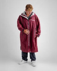 *MALE* in studio wearing AW25 Burgundy Dryrobe® advance long sleeve 