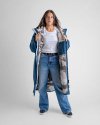 Female in studio wearing AW25 Blue Dryrobe® advance long sleeve 