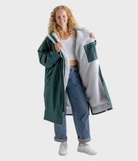 Female in studio wearing AW25 Green Dryrobe® advance long sleeve 