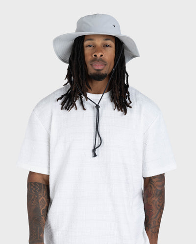 Male in studio wearing grey Dryrobe® water resistant wide brimmed hat 