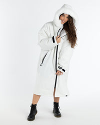 Woman wearing dryrobe Advance Long Sleeve Alpine Range change robe in Alpine White 
