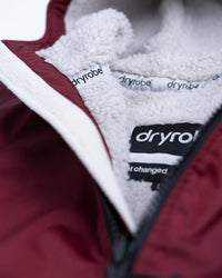 Detail studio shot of AW25 Burgundy Dryrobe® advance long sleeve 
