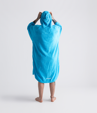 *MALE* Person wearing a blue hooded towel robe on a white background
