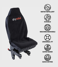 A black Dryrobe car seat cover shown on a vehicle seat against a light gray background, with a vertical list of feature icons on the right reading water-repellent, durable, machine washable, universal fit, super-warm, and quick drying.