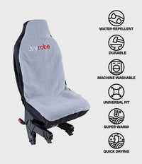 A car seat cover by dryrobe shown on a black car seat, with feature icons on the right listing water-repellent, durable, machine washable, universal fit, super-warm, and quick drying.
