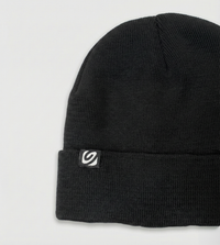 Black beanie with a logo on a light gray background