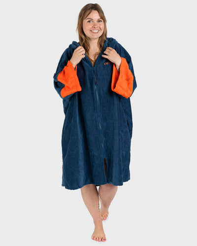 Female in studio wearing Dryrobe® Zip towel (blue orange)