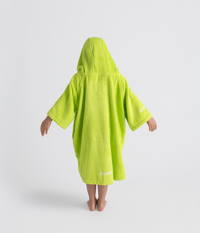 Person wearing a bright green hooded towel robe on a white background