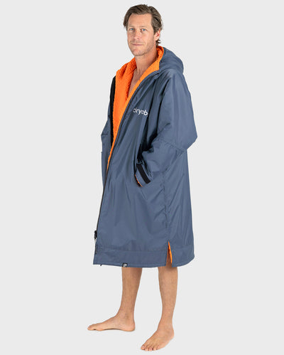 *MALE* Person wearing a grey Dryrobe with orange interior on a white background