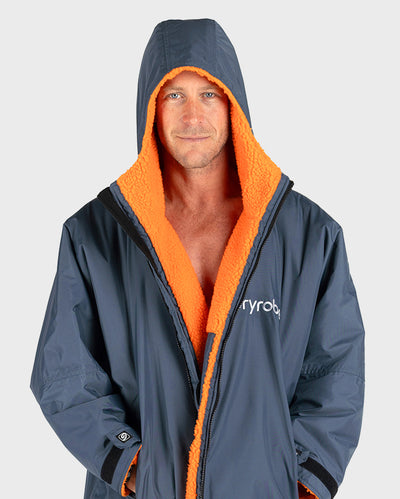 *MALE* Man wearing a grey and orange hooded Dryrobe with 'Dryrobe' branding on a white background