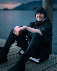 *MALE* sitting by lake wearing Tech-Lite Dryrobe®