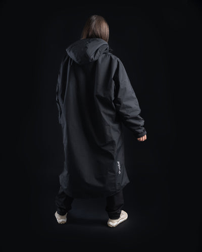 *FEMALE* Person wearing a black Nexus on a black background