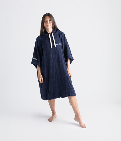 Person wearing a navy blue hooded towel robe with a brand logo on a white background