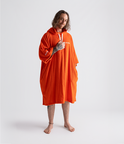 *MALE* Person wearing an orange hooded towel robe on a white background