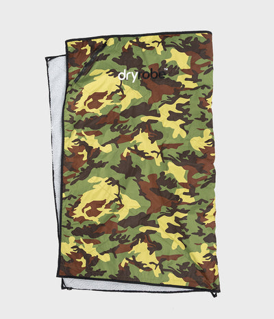 A camouflage dryrobe picnic blanket with a green, brown, and yellow camo pattern, featuring a white 'dryrobe' logo printed on the front. The bag is shown partially unzipped to reveal a light grey interior lining, set against a solid light grey background.