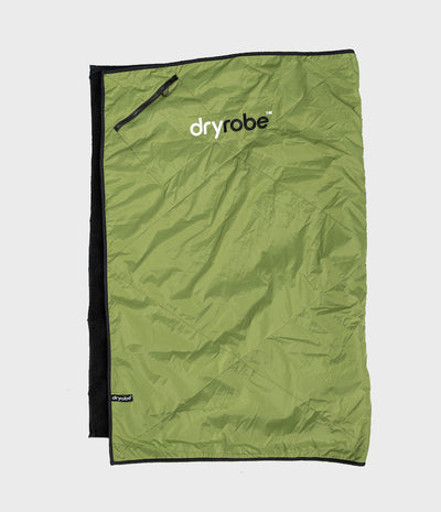 An olive green Dryrobe picnic blanket with black trim and a black zipper, laid flat on a light grey background.