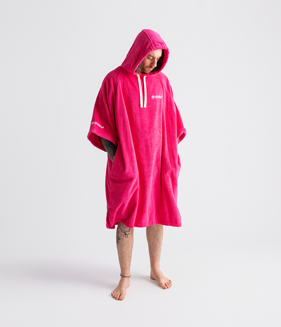 *MALE* Person wearing a pink hooded towel robe on a white background