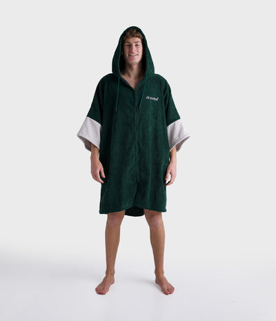 *MALE* Person wearing a green hooded towel with white sleeves on a white background