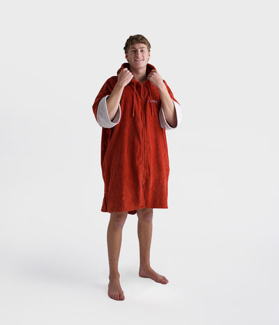 *MALE* Person wearing a red hooded towel on a white background
