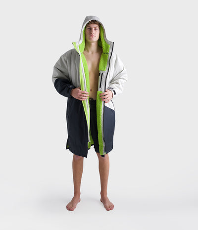 *MALE* Person wearing a grey and green Dryrobe on a white background