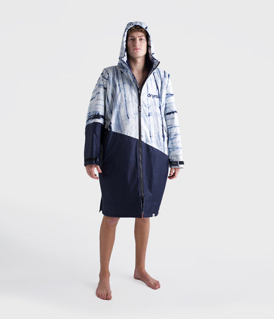 *MALE* Person wearing a hooded Dryrobe with a tie-dye pattern on a white background