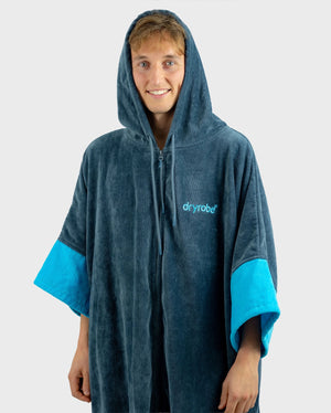 *MALE* Person wearing a blue and grey dryrobe on a white background