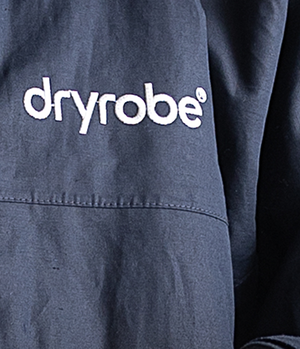 Dryrobe logo on a dark blue garment