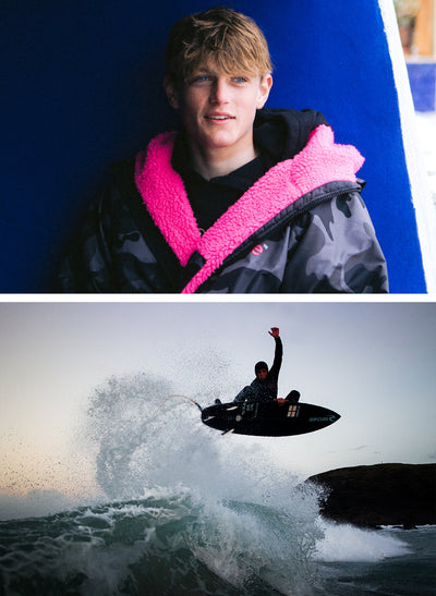 Lukas Skinner, professional surfer wearing black camo pink Dryrobe® long sleeve advance and surfing a wave