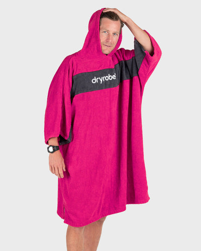 Man wearing Organic Towel dryrobe Remix in Pink Slate Grey with hood up 