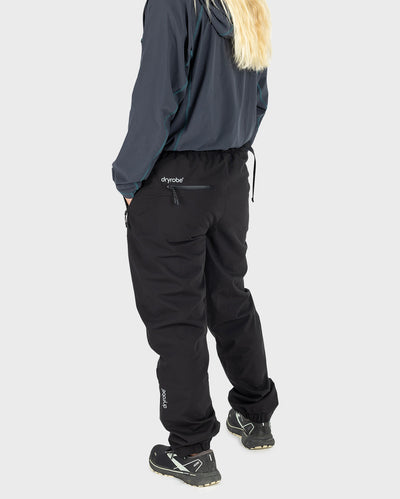 Woman stood facing away from camera, wearing dryrobe® Thermal Trousers
