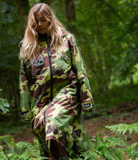 Adult female in woods wearing Red Bull Hardline camo grey long sleeve Dryrobe®