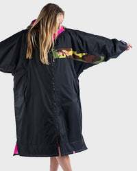 Woman with arms out to the side, wearing Black Pink Camo dryrobe Advance Long Sleeve REMIX Range