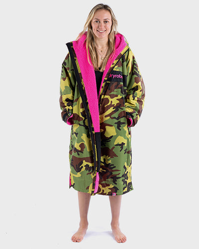 Woman wearing dryrobe Advance Long Sleeve REMIX Range change robe in Camo Pink Black